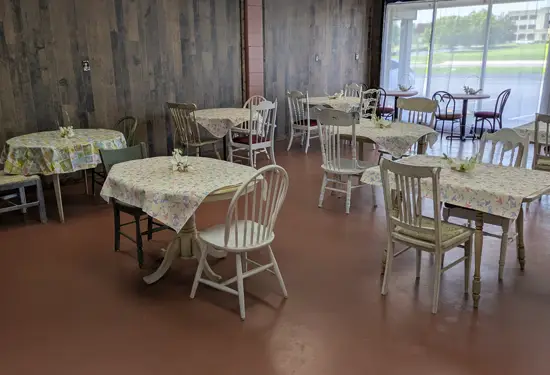 Kozy Cakes party room with multiple decorated tables and large front windows